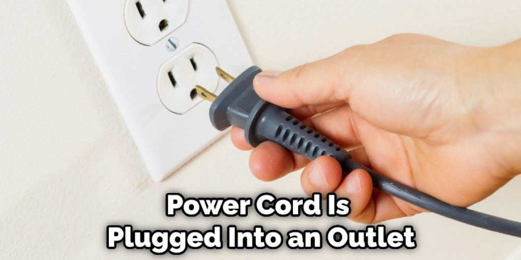 Power Cord Is Plugged Into an Outlet