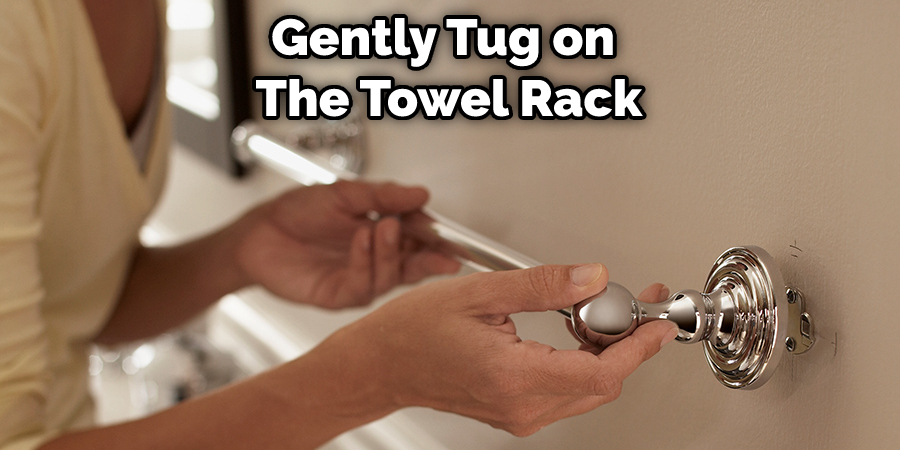 Gently Tug on  The Towel Rack