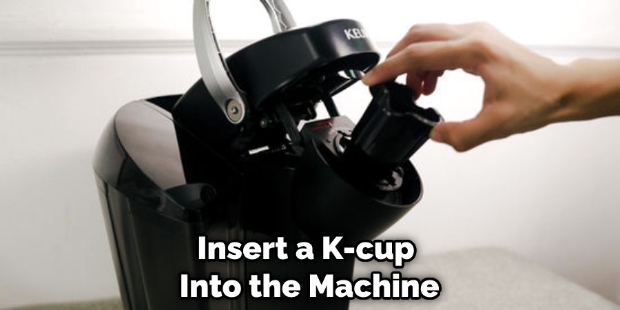 insert a K-Cup into the machine