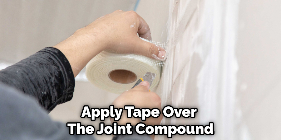 Apply Tape Over  The Joint Compound