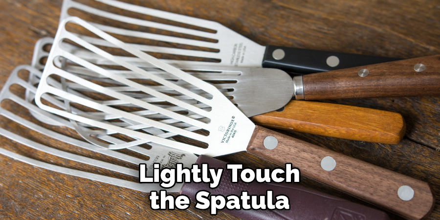 Lightly Touch the Spatula
