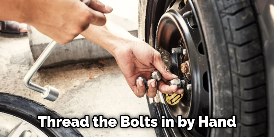 Thread the Bolts in by Hand