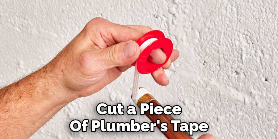 Cut a Piece Of Plumber's Tape