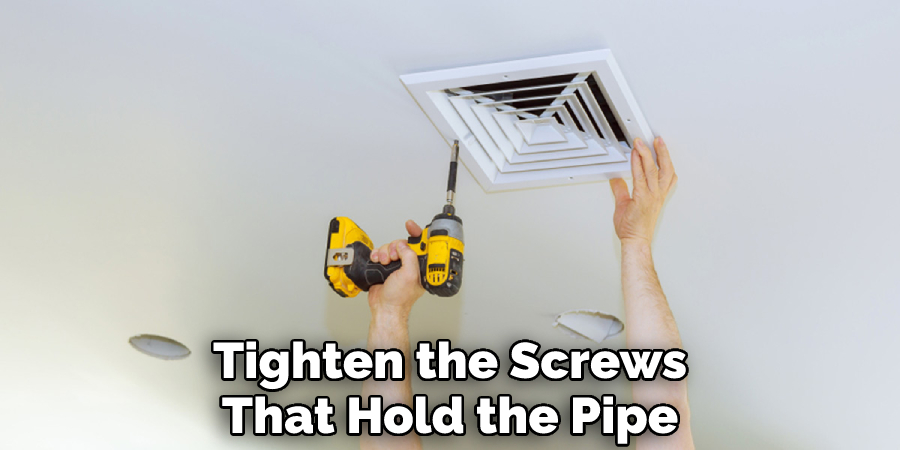 Tighten the Screws
That Hold the Pipe