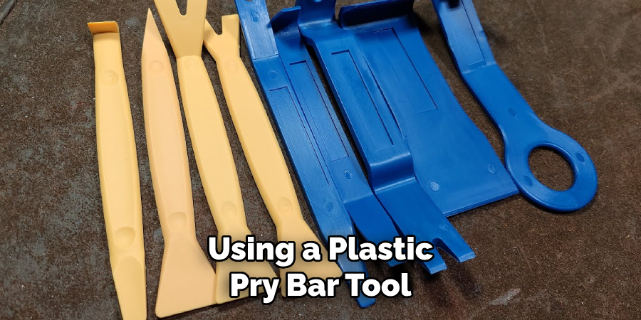 Using a Plastic Pry Bar Tool