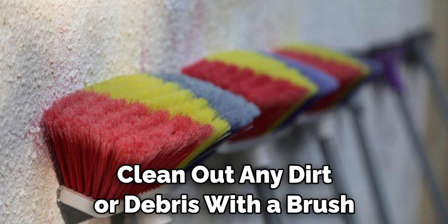 Clean Out Any Dirt or Debris With a Brush