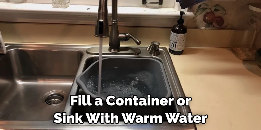 Fill a Container or Sink With Warm Water