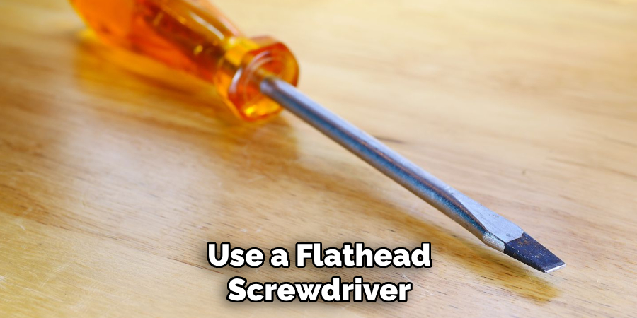 Use a Flathead Screwdriver