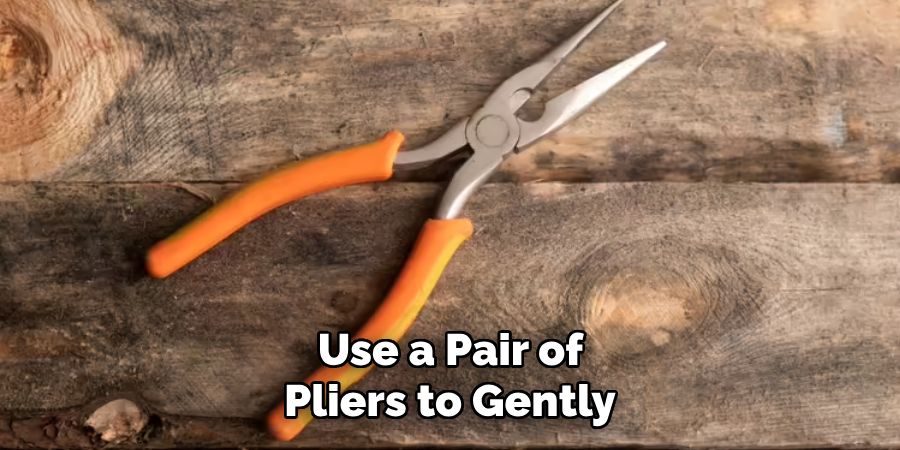  Use a Pair of Pliers to Gently