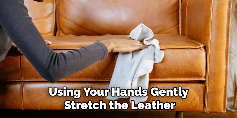 Using Your Hands Gently Stretch the Leather
