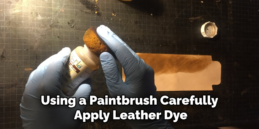 Using a Paintbrush Carefully Apply Leather Dye