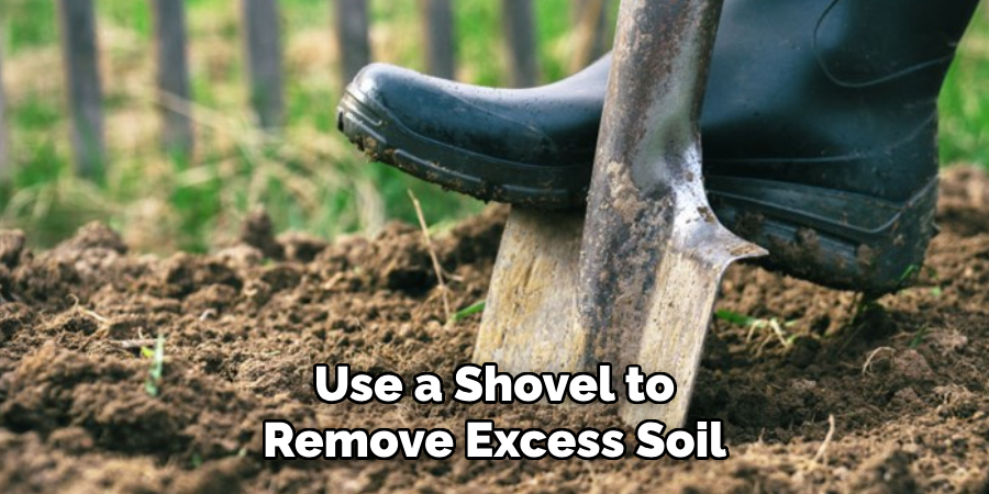 Use a Shovel to Remove Excess Soil
