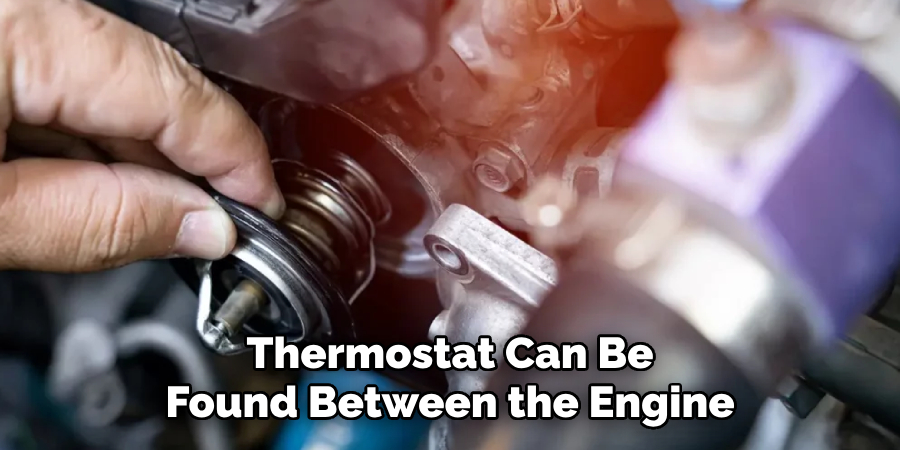 Thermostat Can Be Found Between the Engine
