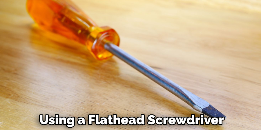 Using a Flathead Screwdriver