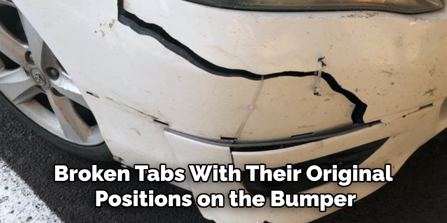 Broken Tabs With Their Original 
Positions on the Bumper