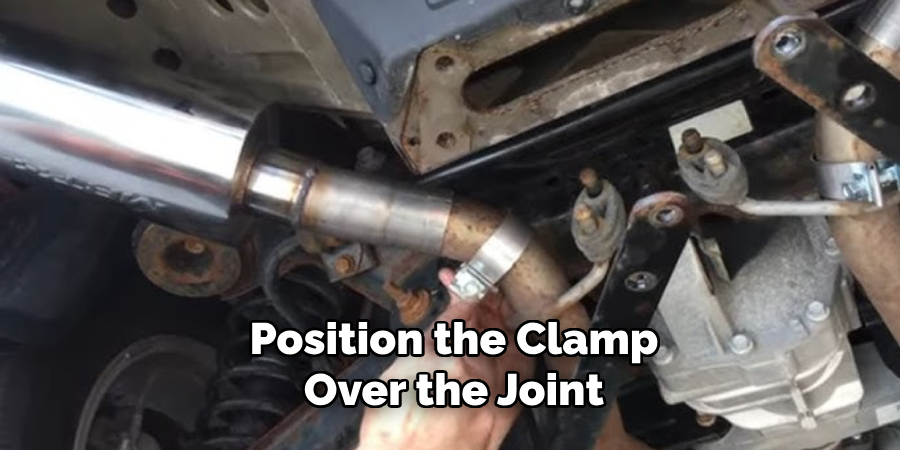 Position the Clamp
 Over the Joint 