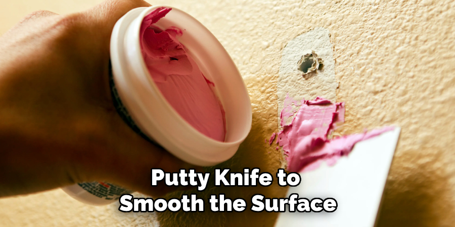 Putty Knife to 
Smooth the Surface