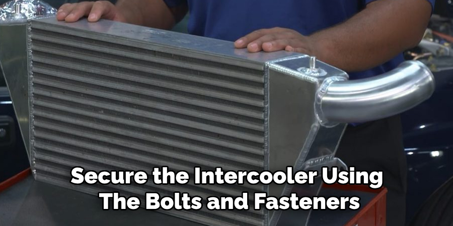 Secure the Intercooler Using 
The Bolts and Fasteners